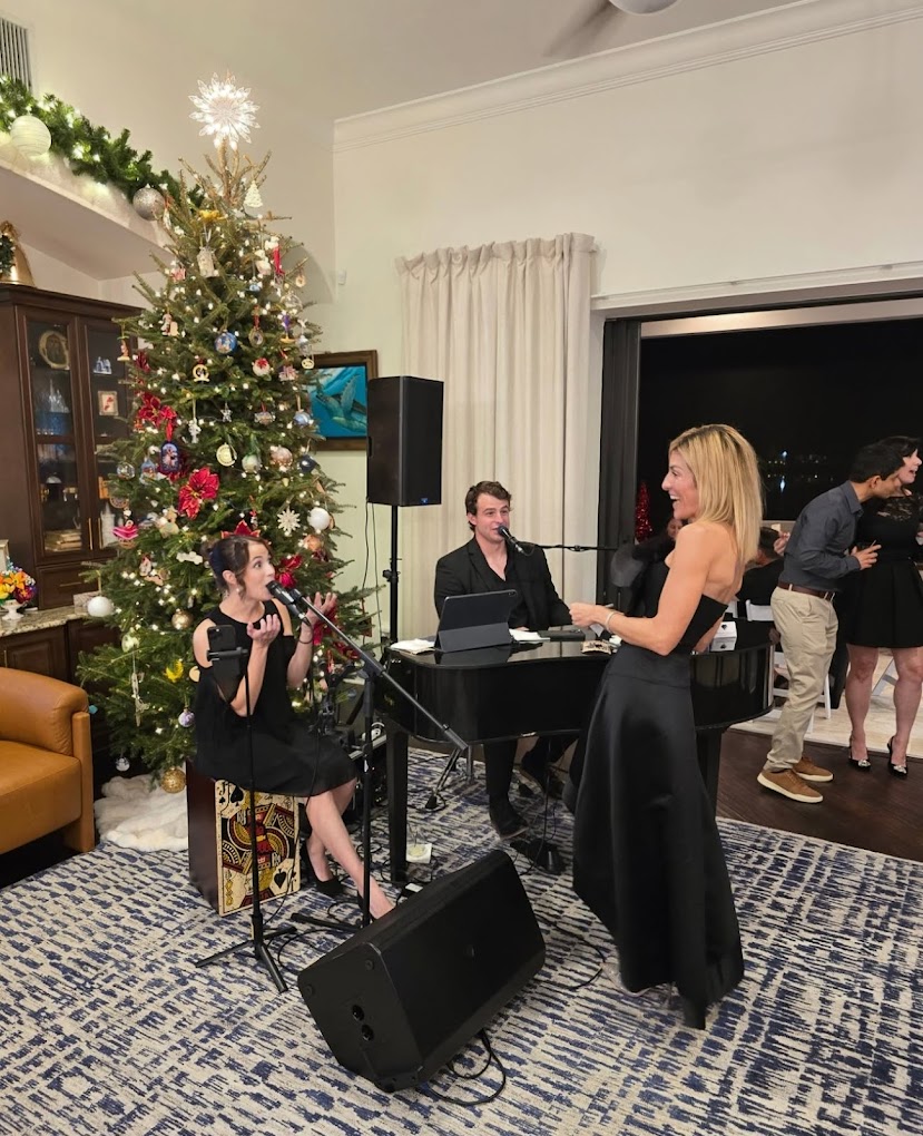 Chase and Esmeralda engaging with a guest during their duo show